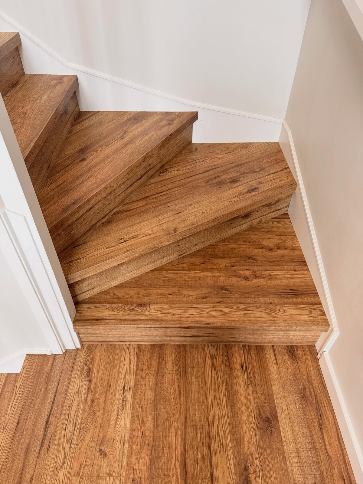 Laminate fitted to the turning stair treads.