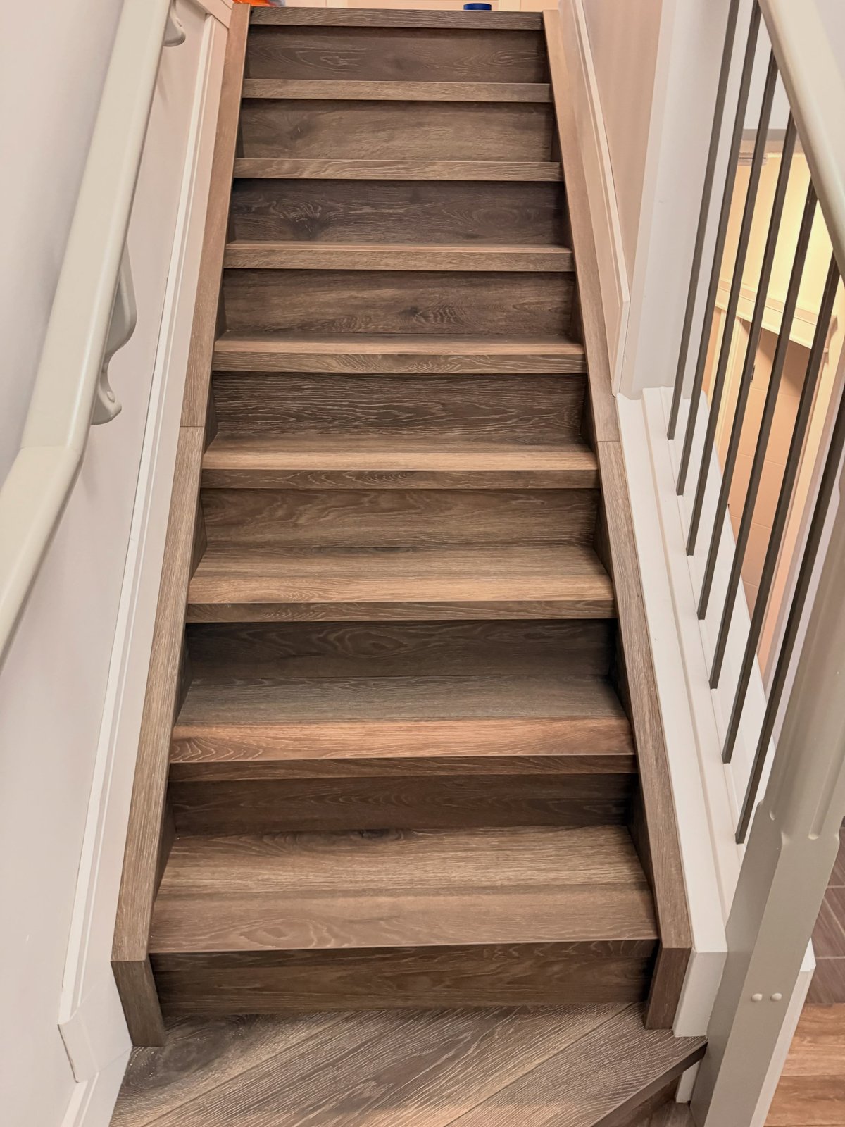 Laminate stair treads and matching risers, viewed from below.